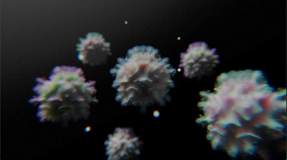 Soft-focus render of colorful fuzzy forms floating against black.